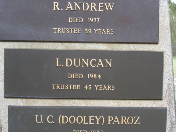Helidon Cemetery Trustees memorial;  | A. TIGHE, trustee 38 years;  | R. ANDREW, died 1977, trustee 39 years;  | L. DUNCAN, died 1984, trustee 45 years;  | U.C. (Dooley) PAROZ, died 1987, trustee 31 years;  | C. GREER, died 1987, trustee 40 years;  | W.A. BATEMAN, died 1989, trustee 33 years;  | B.A. HAWLEY, died 1990, trustee 13 years;  | Helidon General cemetery, Gatton Shire  | 